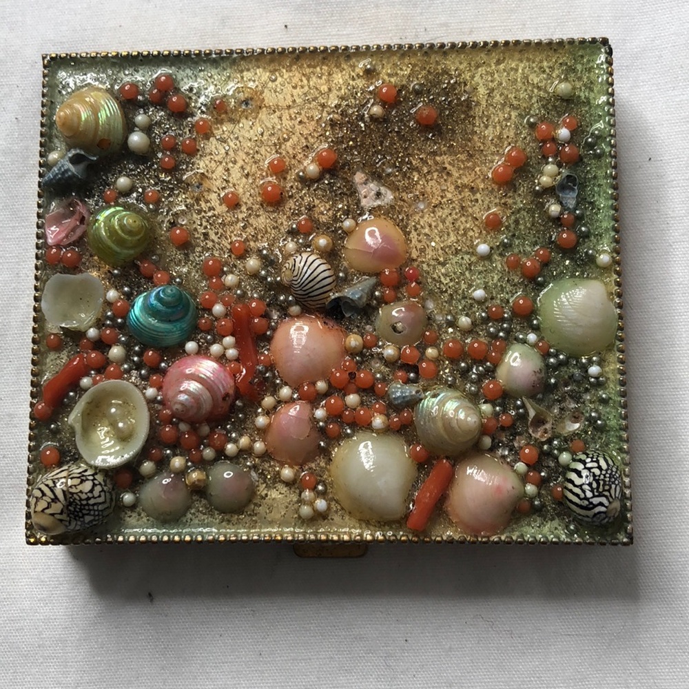 Vintage Seashell compact with mirror and powder .